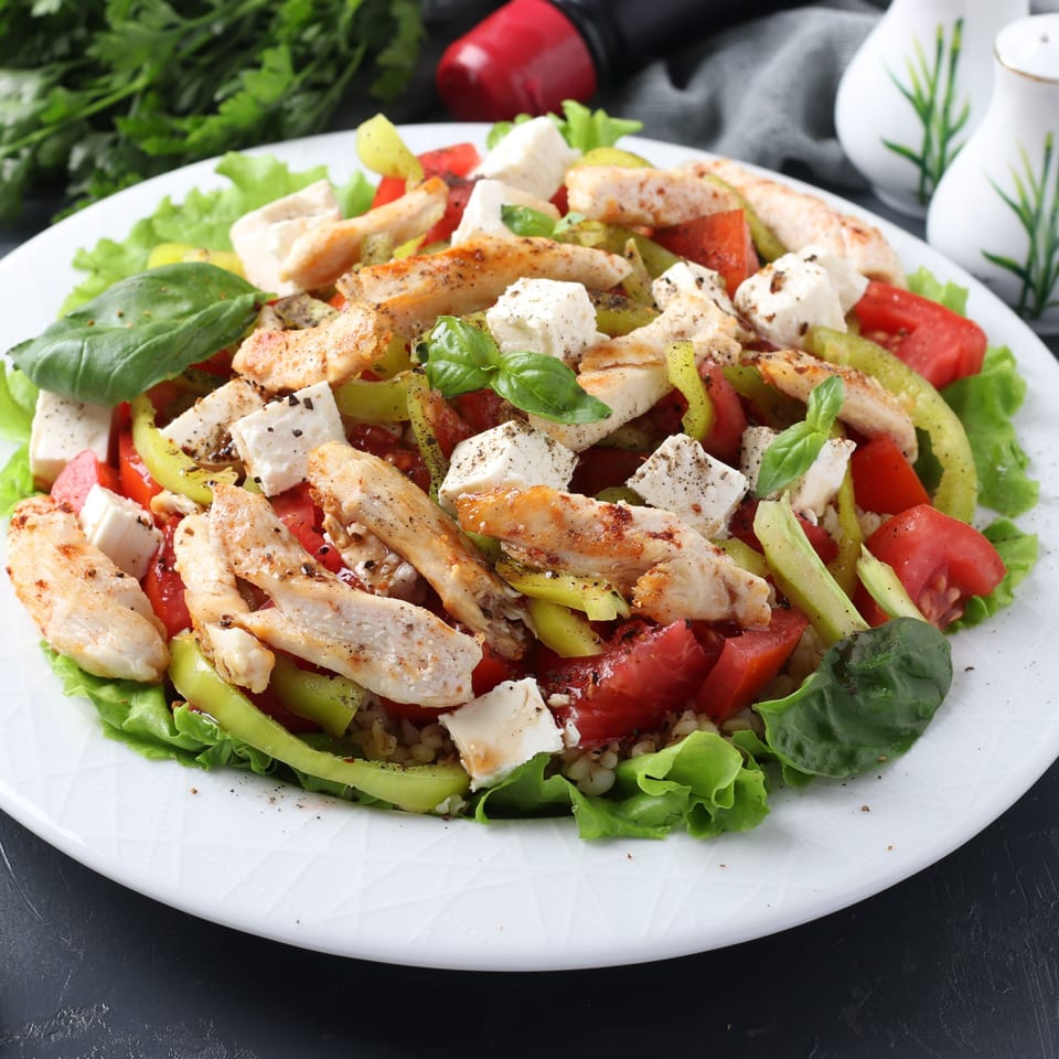 Wolfy's Leesburg Restaurant's grilled chicken salad with feta, tomatoes, peppers, and basil.